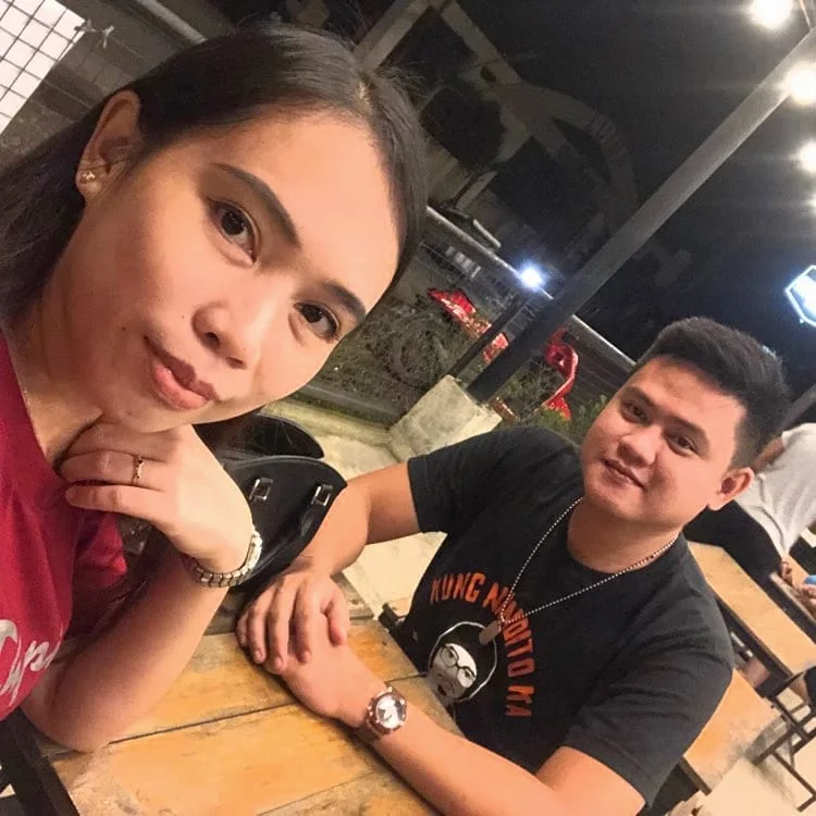 Nico and his partner photographed on a phone at a restaurant one evening